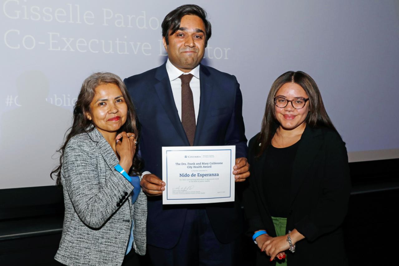 NYC Health Commissioner Ashwin Vasan poses with Nido de Esperanza's Gisselle Pardo and Kimberly Polanco