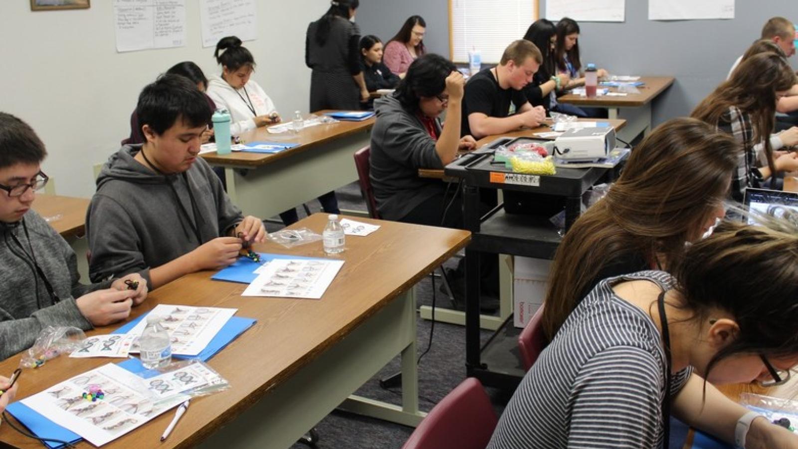 people at desks working on projects