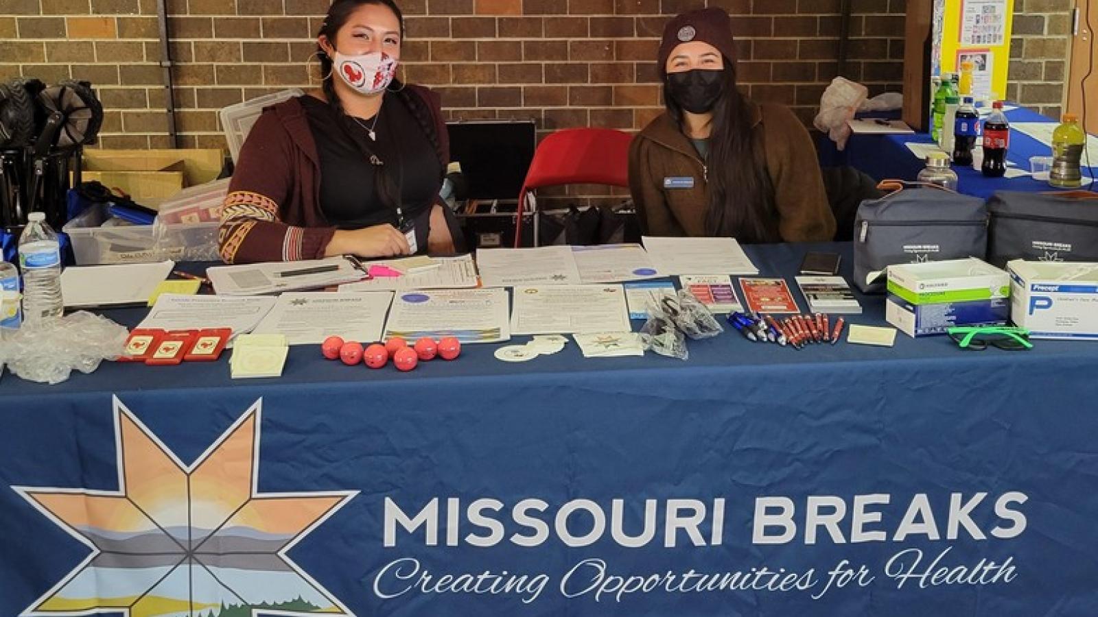 Two people sitting at a Missouri Breaks table