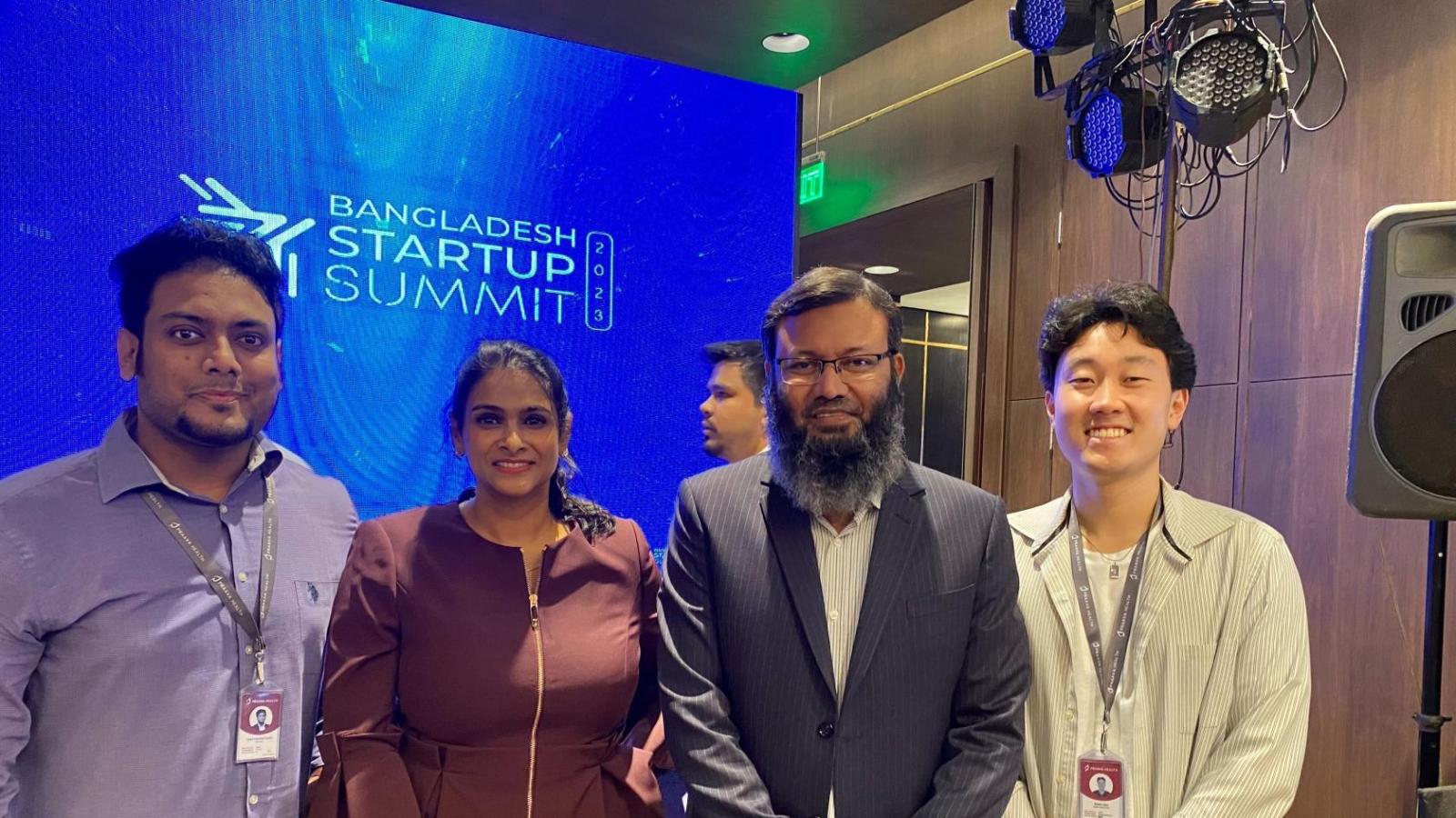 Robin Kim, Dhaka, Bangladesh, with the hosting Praava Health team presenting at a national conference