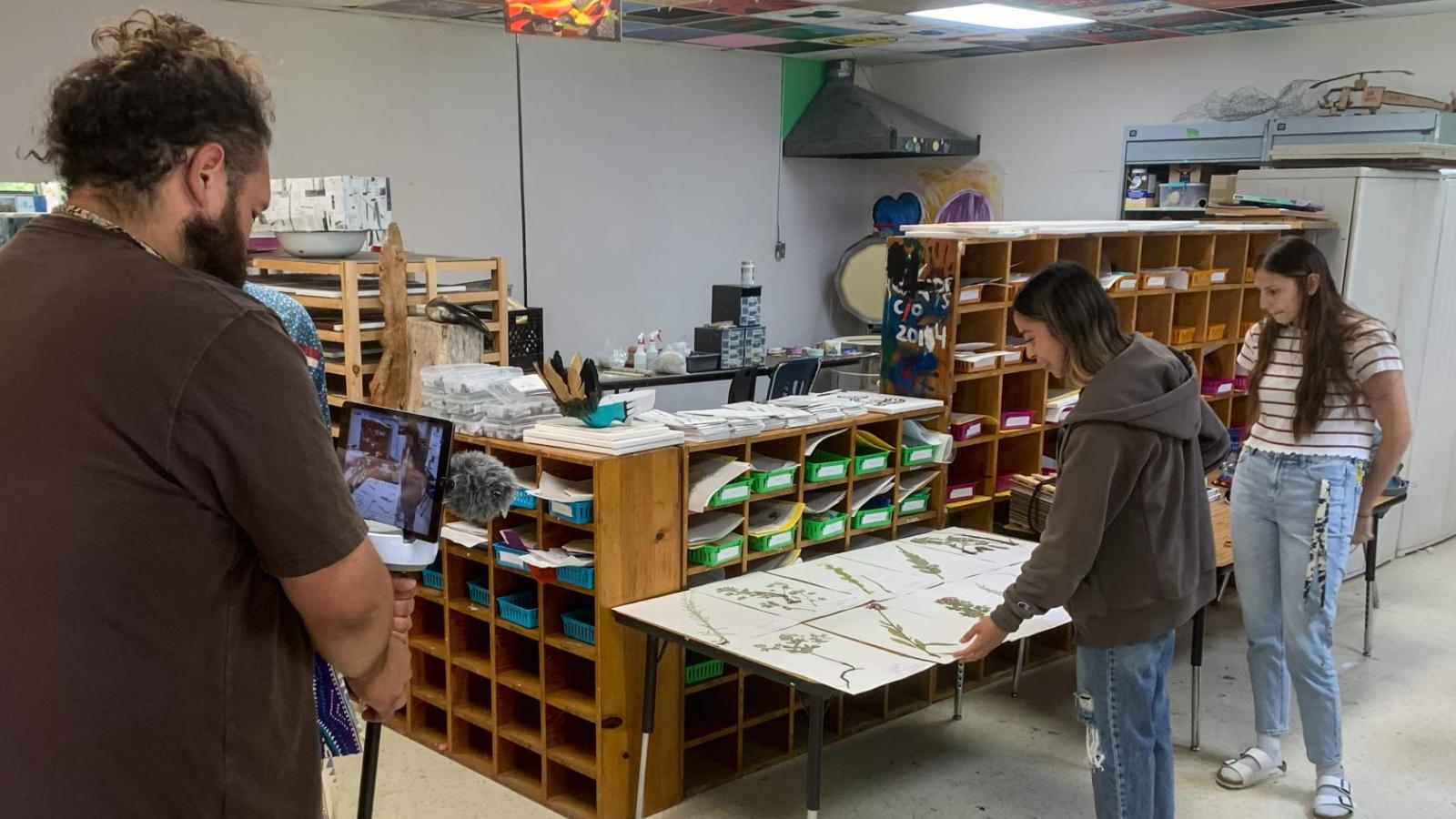 a person filming presentations on facebook live about traditional plants