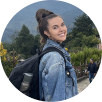 Emelia headshot with a jean jacket and backpack