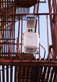 An air pollution monitor installed on a fire escape