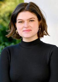 A woman wearing a black top