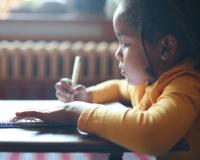Image of child writing