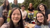 Kupsco Lab Members sitting outside in a park having a picnic
