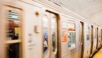 Blurred New York CIty subway moving in a station.