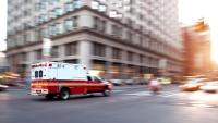 A ambulance crosses an intersection in New York City