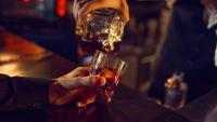 Alcoholic drink being pured into glass