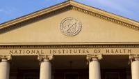 A Greek-style building with text on the building that reads "National Institutes of Health"