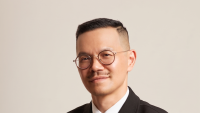 man in glasses in black suit