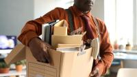 Worker leaving his job with belongings
