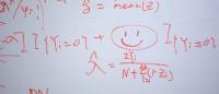 formula on a whiteboard with a smiley face