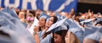 A mass of graduates wearing Columbia blue