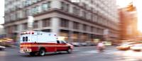 A ambulance crosses an intersection in New York City