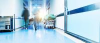 Doctors or nurses walking in hospital hallway, blurred motion