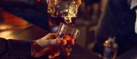 Alcoholic drink being pured into glass