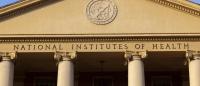 A Greek-style building with text on the building that reads "National Institutes of Health"