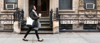 Pregnant woman walking on urban street