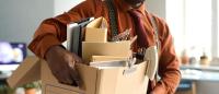 Worker leaving his job with belongings